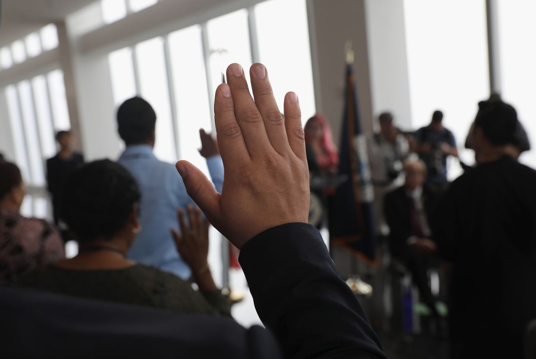 Immigrants take the oath of allegiance to the United States at a naturalization ceremony held in the observatory of the One World Trade Center on August 15, 2017 in New York City<br>